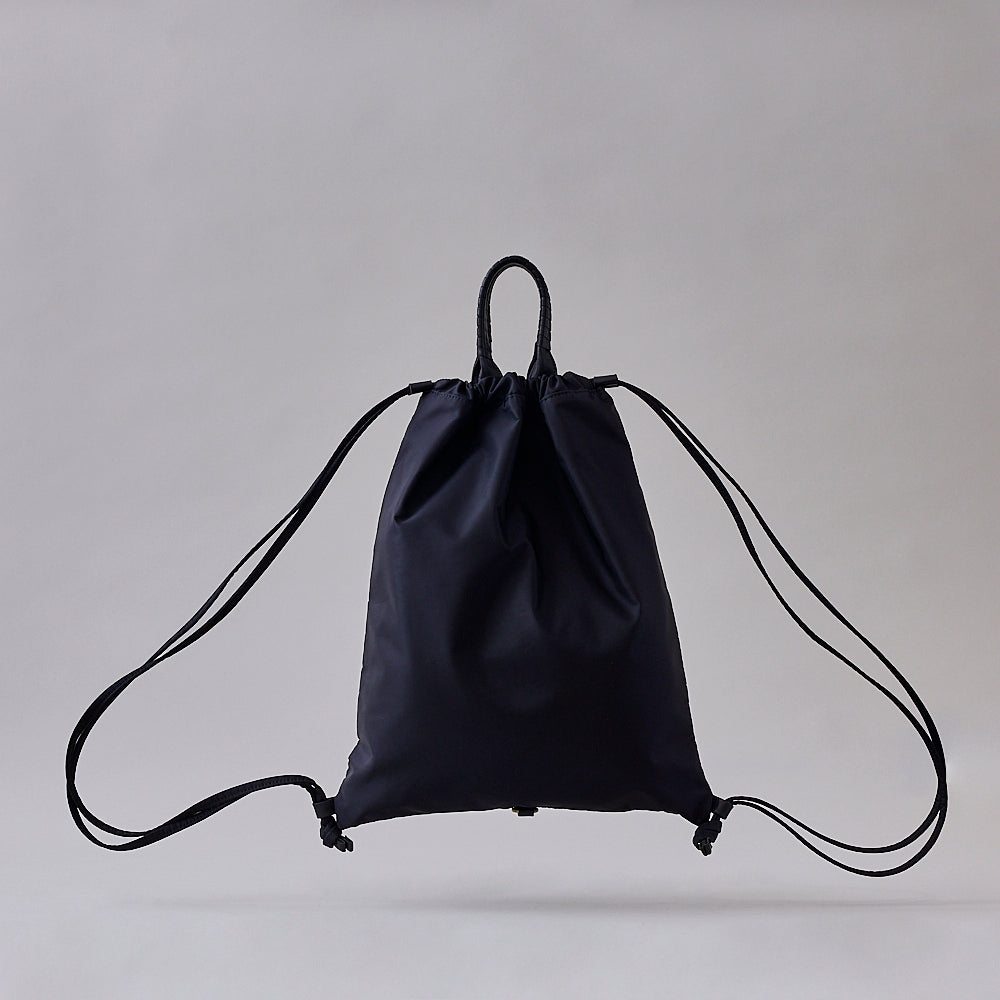 祖母からもらったバック pack TOTE SACK / co25fwpt010 / R Nylon*cow leather – cornelian