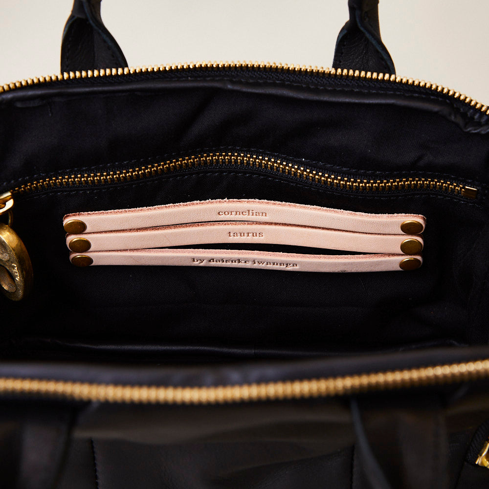 motion mini / co21ssmm040 / smooth leather – cornelian taurus by